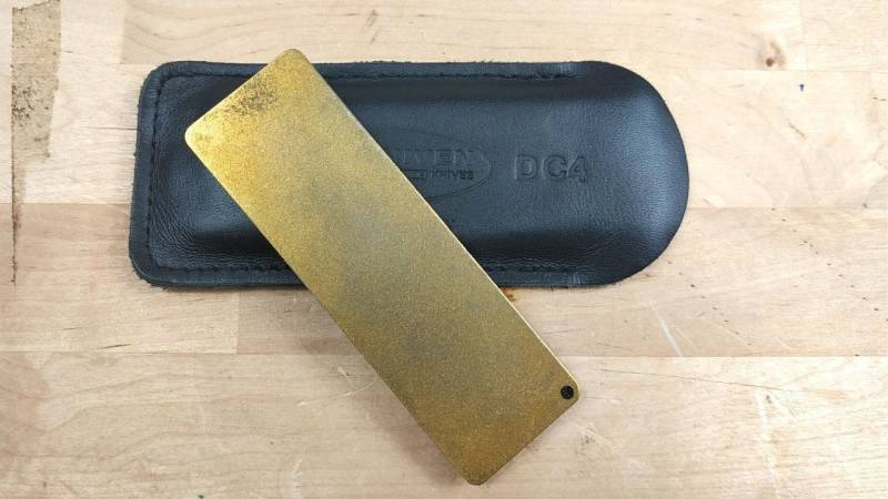A small pocket sharpening stone with diamond on one side (visible) and ceramic on the other side to keep your knife sharp in the field