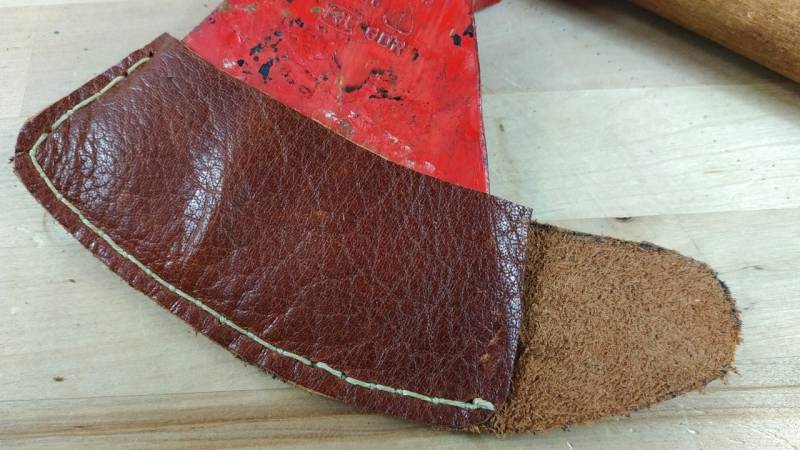 Adjust the axe leather sheath now and check if it fits well