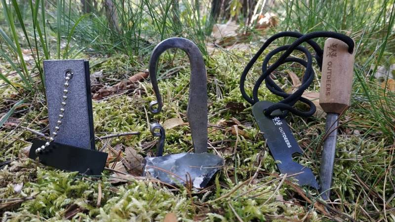 Various fire starters: magnesium block with fire starter, flint and steel, and a fire starter