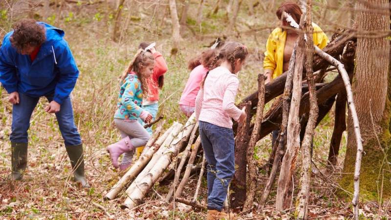 Children get creative in outdoor play in the forest