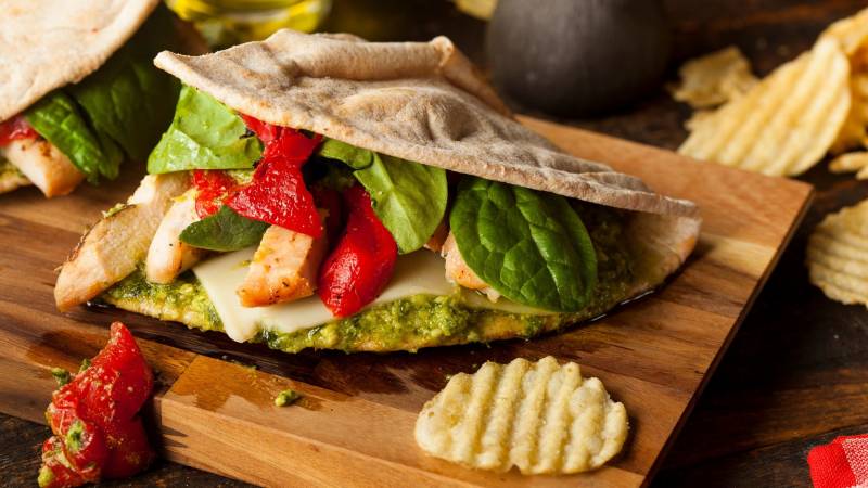 Pesto on bread is flavorful and goes well with tomatoes and cucumbers