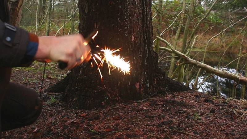 Sparks with the back of the knife and the fire steel.