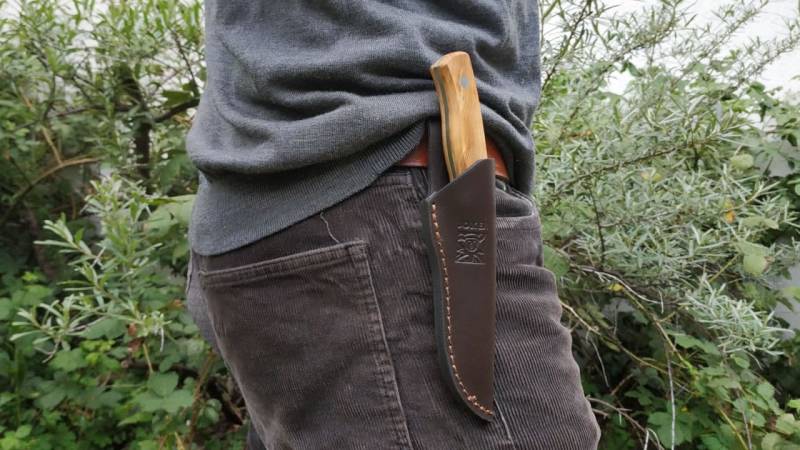 The leather sheath has a belt loop