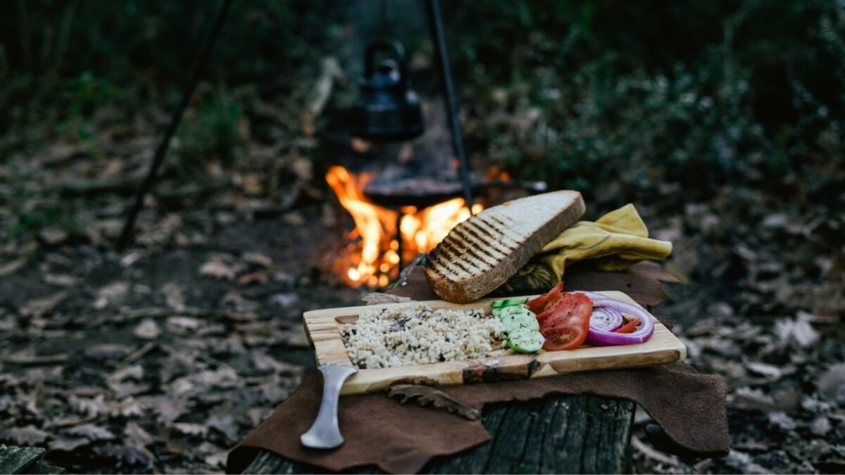 A fire, a snack, a tarp, and a knife - sometimes that's all you need