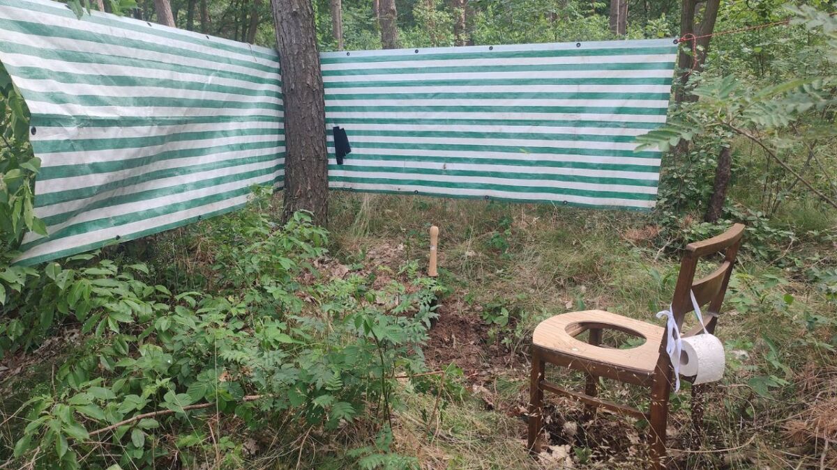 A latrine for multiple people: you need a hole and ideally a privacy screen