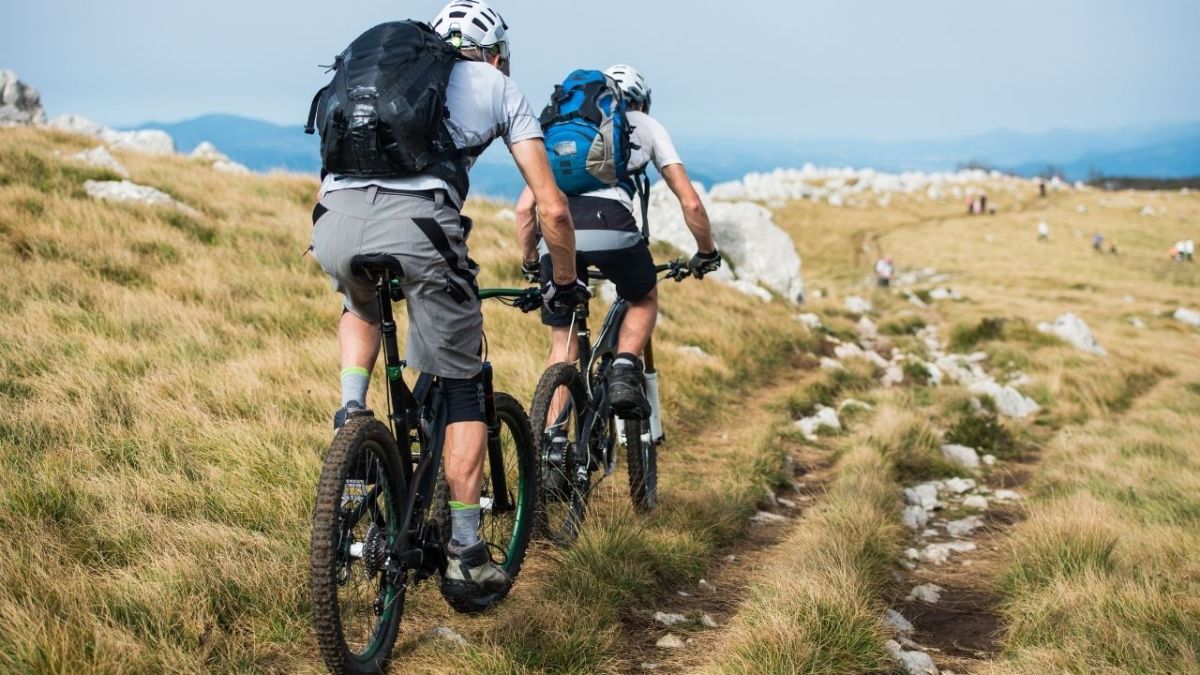 Mountain biking is an outdoor sport where one rides a bicycle over rough terrain and obstacles. People ride mountain bikes to enjoy nature, exercise, and adventure.