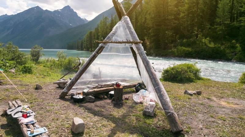 A shelter with plastic tarps