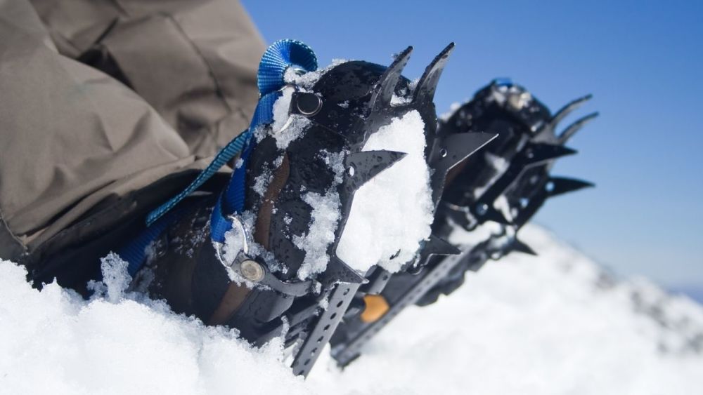A crampon is a device that is attached to the bottom of your shoe and greatly facilitates your ascent on steep slopes. They are usually used in mountaineering, where you may have to climb rocks or even snow and ice. Since they help the wearer to find better grip on slippery surfaces, they are often used in conjunction with an ice axe.