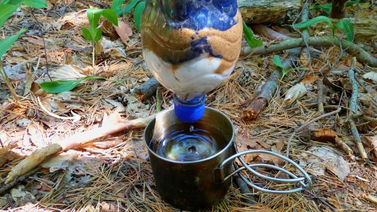 The Survival Water Filter - at the bottom of the bottle you can see the cellulose, a layer of fabric and sand