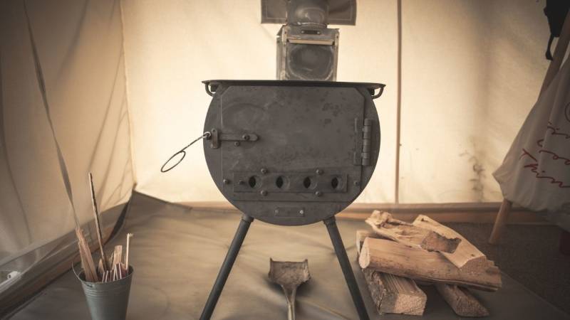 Getting cozy and warm in the tent with a tent stove